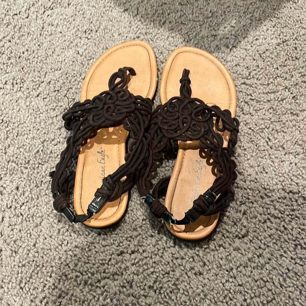 Tan and black strap sandals
